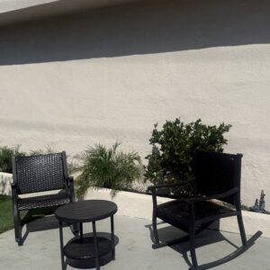 Outdoor seating with chairs and greenery at Harbor Care Foundation facility.